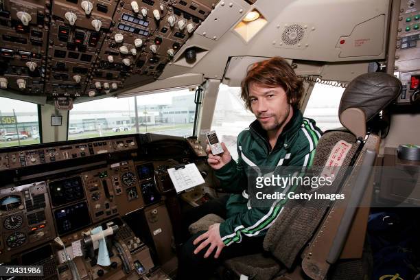 Jamiroquai frontman Jay Kay poses at a photocall prior to Sony Ericsson's Gig in the Sky in the cockpit of a private jet at Stansted Airport on...