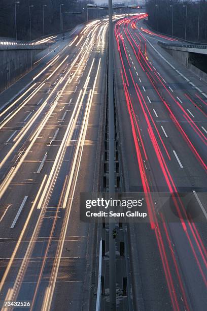 Cars, trucks and other traffic speed along the A100 ring road at rush hour February 21, 2007 in Berlin, Germany. Auto emissions has become a hot...