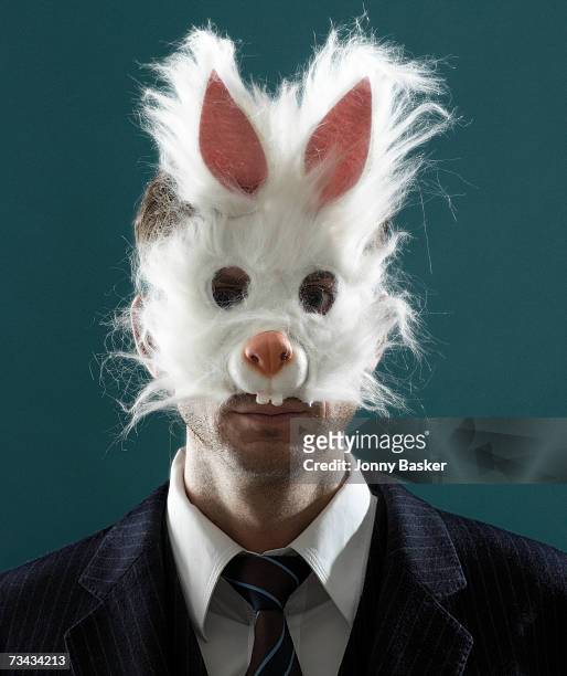 man in suit wearing rabbit mask, portrait - rabbit mask stockfoto's en -beelden
