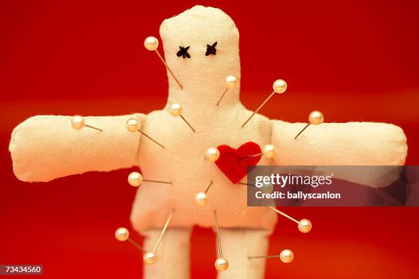 voodoo doll with straight pins - voodoo stock pictures, royalty-free photos & images