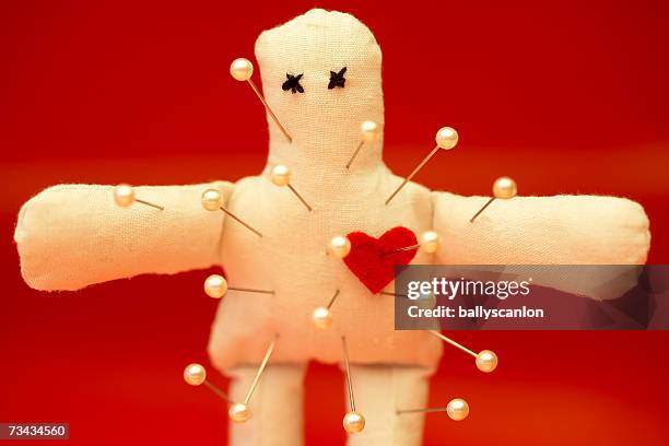 voodoo doll with straight pins - voodoo stock pictures, royalty-free photos & images