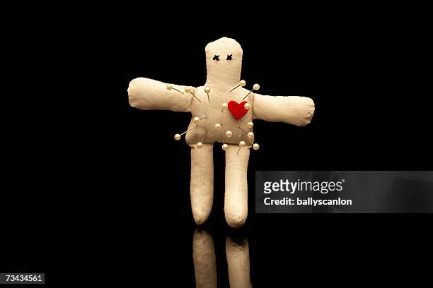 voodoo doll with straight pins - voodoo doll stock pictures, royalty-free photos & images