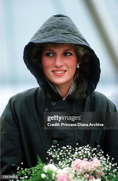 Princess Diana wearing a green barbour coat against the rain at Ardveenish on the island of Barra during a tour of the Western Isles, July 1985.