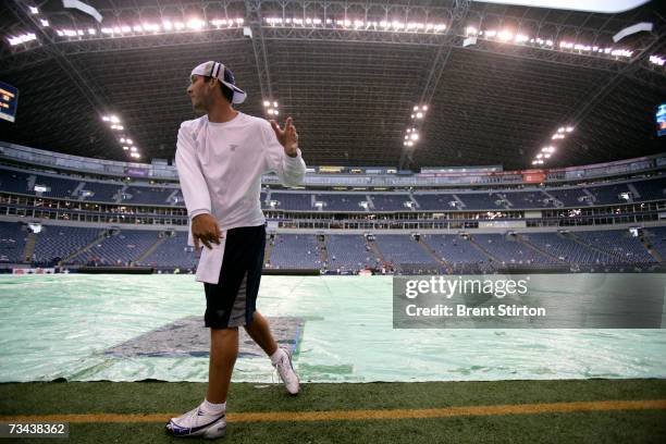 Quarterback Tony Romo of the Dallas Cowboys warms up before play against the Washington Redskins at Texas Stadium in Dallas, Texas on September 17,...