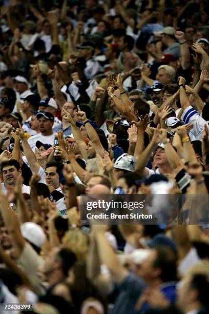 Scenes from a rain-swept football match setting the Dallas Cowboys against the Washington Redskins at Texas Stadium in Dallas, Texas on September 17,...