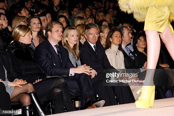 Segolene Frere, Alessandro Vallarino Gancia, Delphine Arnault and Bernard Arnault attend the Christian Dior Fashion show as part of Paris Fashion...
