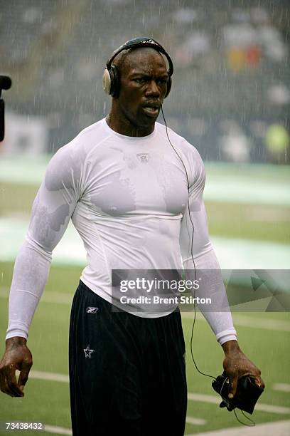 Terrel Owens, wide receiver for the the Dallas Cowboys, warms up before a match against the Washington Redskins at Texas Stadium in Dallas, Texas on...