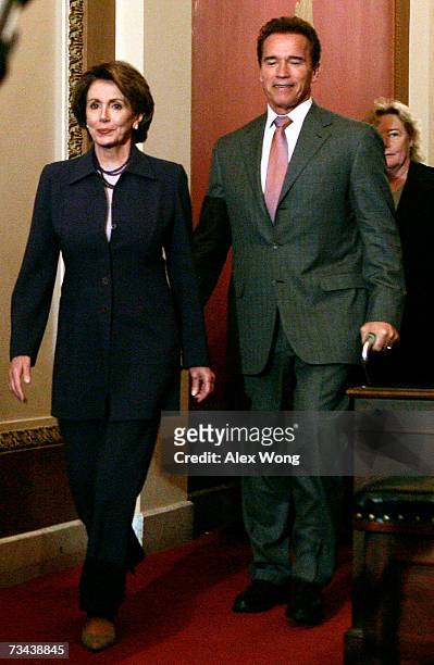 Speaker of the House Rep. Nancy Pelosi walks with California Gov. Arnold Schwarzenegger toward the podium for a briefing after their meeting February...