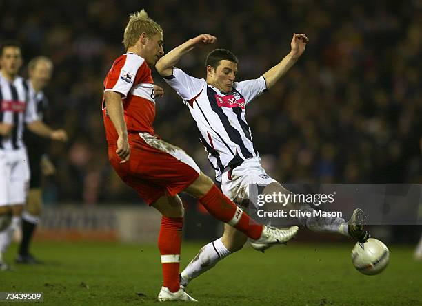 Andrew Davies of Middlesbrough battles for the ball with Jason Koumas of West Bromwich Albion during the FA Cup sponsored by E.ON 5th Round Replay...