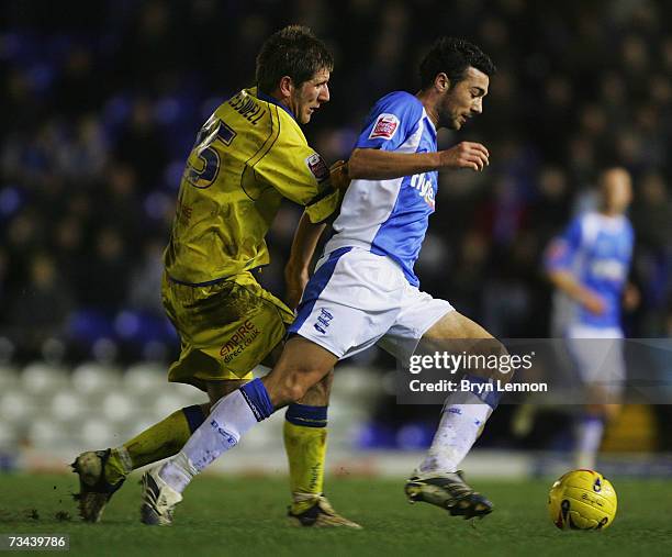 Richard Cresswell of Leeds United tackles Stephen Kelly of Birmingham City during the Coca-Cola Championship game between Birmingham City and Leeds...