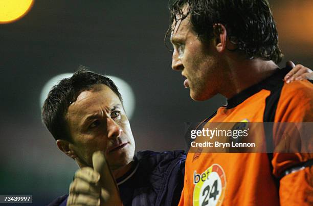 Leeds United Manager Dennis Wise chats to goalkeeper Graham Stack as they leave the pitch after the Coca-Cola Championship game between Birmingham...