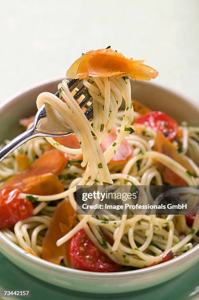 spaghetti with bresaola and tomatoes - bresaola stock pictures, royalty-free photos & images