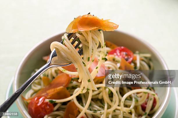 spaghetti with bresaola and tomatoes - bresaola stock pictures, royalty-free photos & images