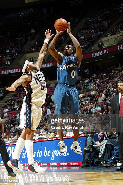 Gilbert Arenas of the Washington Wizards shoots against Eddie House of the New Jersey Nets on February 27, 2007 at Continental Airlines Arena in East...