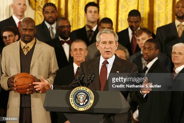 President George W. Bush greets members of the 2006 NBA Champions Miami Heat during their visit to the White House on February 27, 2007 in...