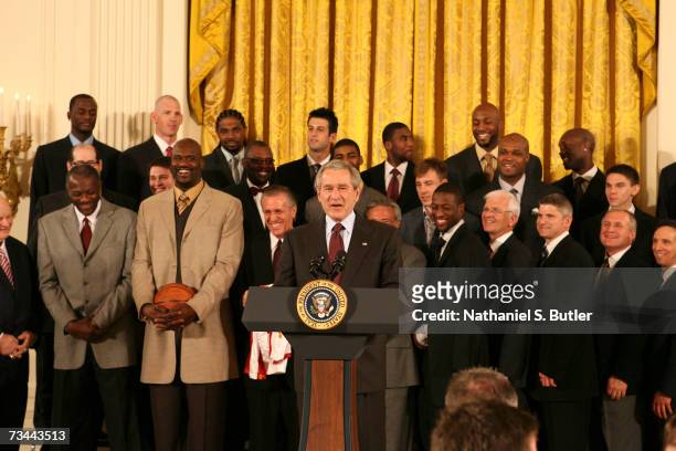 President George W. Bush greets members of the 2006 NBA Champions Miami Heat during their visit to the White House on February 27, 2007 in...
