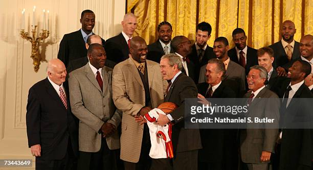 Shaquille O'Neal of the Miami Heat speaks with President George W. Bush during the 2006 NBA Champions Miami Heat visit to the White House on February...
