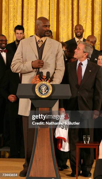 Shaquille O'Neal of the Miami Heat speaks with President George W. Bush during the 2006 NBA Champions Miami Heat visit to the White House on February...