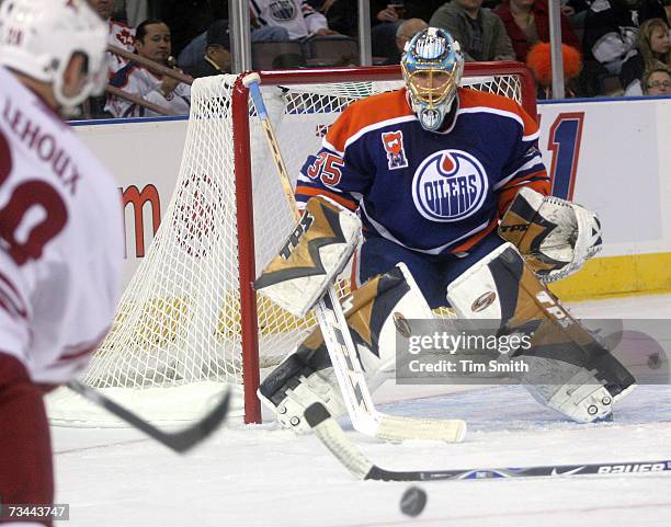 Yanick Lehoux of the Phoenix Coyotes rifles a shot on goalie Dwayne Roloson of the Edmonton Oilers during the second period on February 27, 2007 at...