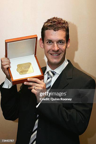 Nathan Deakes of Australia poses with his award during the Athletics Australia John Landy Lunch Club and Melbourne Telstra A-Series Media Conference...