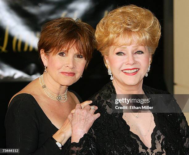 Actress Carrie Fisher and her mother, actress Debbie Reynolds, arrive for Dame Elizabeth Taylor's 75th birthday party at the Ritz-Carlton, Lake Las...