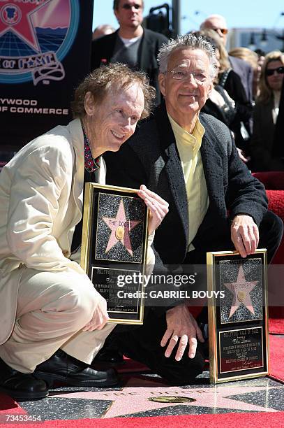 Hollywood, UNITED STATES: Members of the Rock band The Doors, Robby Kreiger and Ray Manzarek pose after been honored by a Star on the Hollywood Walk...