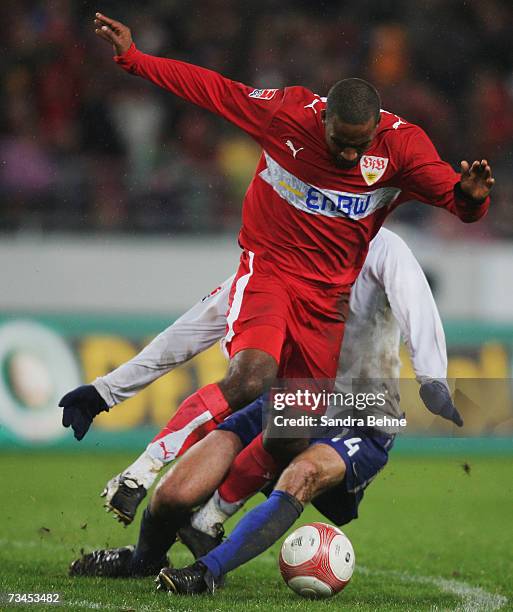 Cacao of Stuttgart is challenged by Josip Simunic of Hertha during the DFB German Cup quarter final match between VfB Stuttgart and Hertha BSC Berlin...