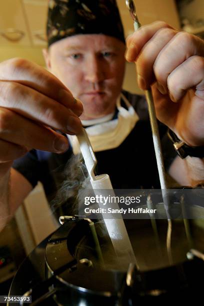 Embryologist Ric Ross pulls out vials of human embryos from a liquid Nitrogen storage container at the La Jolla IVF Clinic February 28, 2007 in La...