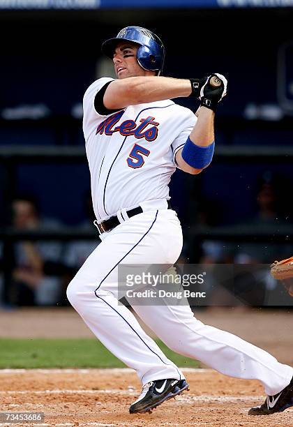 Third baseman David Wright of the New York Mets watches his hit against the Detroit Tigers in a spring training game on February 28, 2007 at...