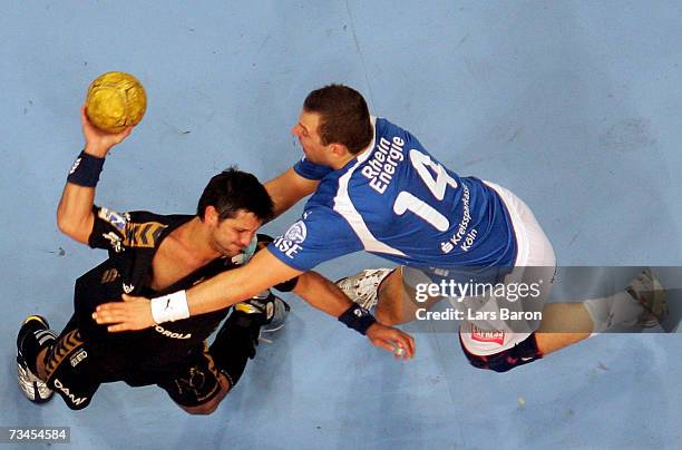 Ljubomir Vranjes of Flensburg in action with Sverre Andreas Jakobsson of Gummersbach during the Bundesliga game between VFL Gummersbach and SG...