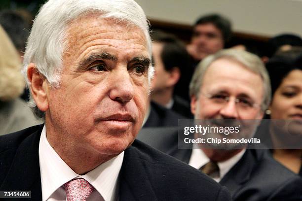 Gary Parsons, Chairman of XM Satellite Radio , sits behind Mel Karmazin, CEO of SIRIUS Satellite Radio, before he testifies during the House...