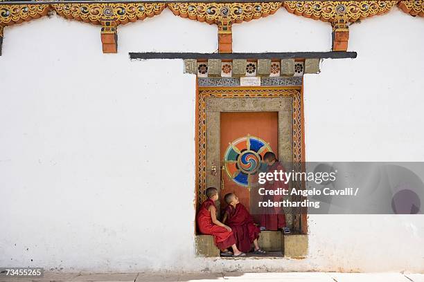 buddhist monks, paro dzong, paro, bhutan, asia - bhutan monk stock pictures, royalty-free photos & images