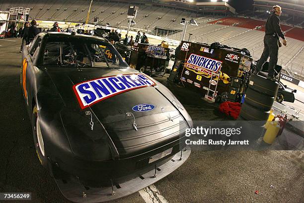 The Snickers Ford driven by Ricky Rudd sits in the pit during the NASCAR Car of Tomorrow testing under the lights at Bristol Motor Speedway on...