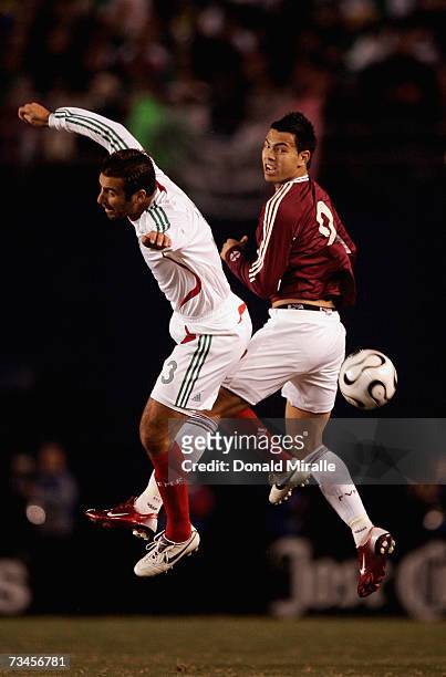 Joaquin Beltran of Mexico clashes with Nicolas Fedor of Venezula during the first half of the Mexico v Venezula friendly match on February 29, 2007...