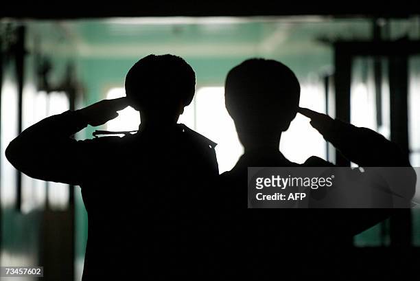 Cadets salute during goose-step lessons at the Military Lycee in the eastern Ukrainian city of Donetsk 28 February, 2007. About 300 cadets aged 15 to...