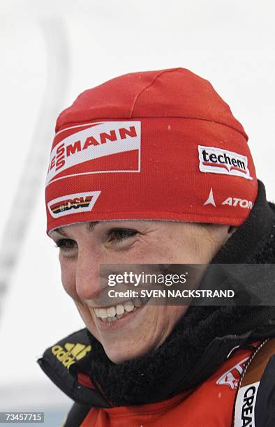 Lahti , FINLAND: Andrea Henkel of Germany smiles after her victory in the IBU Womens 15 km Biathlon in Lahti, Finland, 28 February 2007. In second...