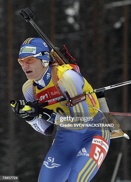Lahti , FINLAND: Overall World Cup leader Swede Anna Carin Olofsson skis to a fourth place in the IBU Womens 15 km Biathlon in Lahti, Finland, 28...