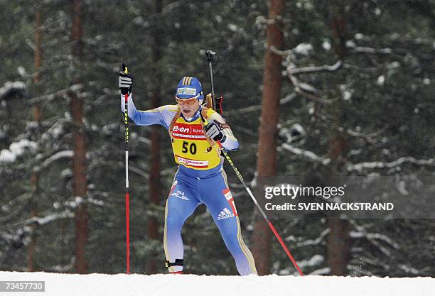 Lahti , FINLAND: Overall World Cup leader Swede Anna Carin Olofsson skis to a fourth place in the IBU Women's 15 km Biathlon in Lahti, Finland, 28...