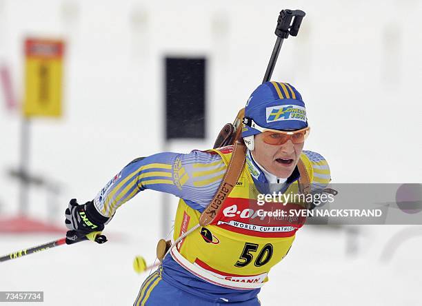 Lahti , FINLAND: Overall World Cup leader Swede Anna Carin Olofsson skis to a fourth place in the IBU Women's 15 km Biathlon in Lahti, Finland, 28...