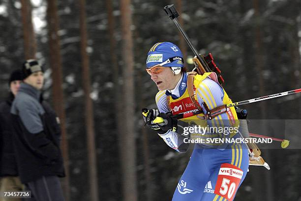 Lahti , FINLAND: Overall World Cup leader Sweden's Anna Carin Olofsson competes to place fourth place in the IBU Women's 15 km Biathlon in Lahti,...