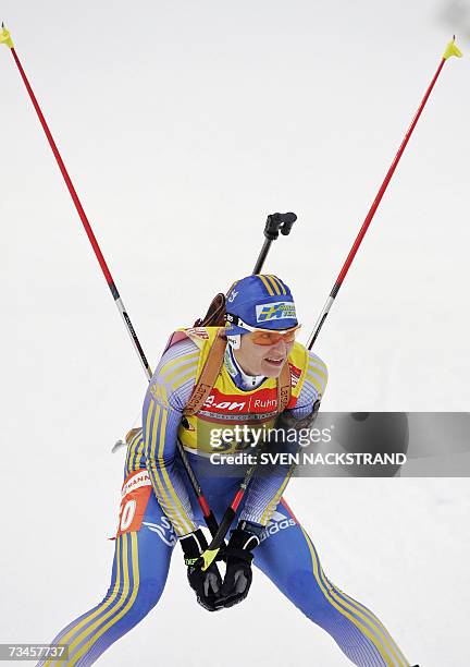 Lahti , FINLAND: Overall World Cup leader Swede Anna Carin Olofsson takes a break after her fourth place in the IBU Women's 15 km Biathlon in Lahti,...