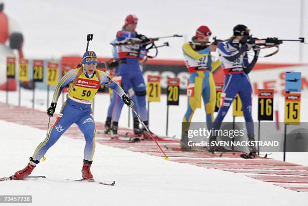Lahti , FINLAND: Overall World Cup leader Swede Anna Carin Olofsson leaves a shooting to a fourth place in the IBU Women's 15 km Biathlon in Lahti,...