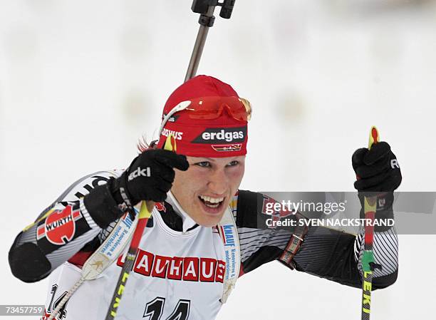 Lahti , FINLAND: Kati Wilhelm of Germany skies to a third place in the IBU Women's 15 km Biathlon in Lahti, Finland, 28 February 2007. Andrea Henkel...