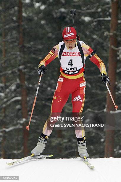 Lahti , FINLAND: Chinese Xianying Liu skies to a fifth place during the IBU Women 15 km Biathlon in Lahti, 28 February 2007. Andrea Henkel of Germany...