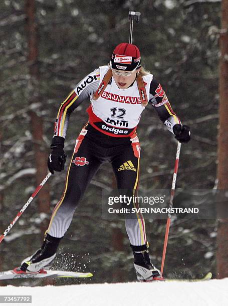 Lahti , FINLAND: Magdalena Neuner of Germany skies to a sixth place in the IBU Women's 15 km Biathlon in Lahti, Finland, 28 February 2007. Andrea...