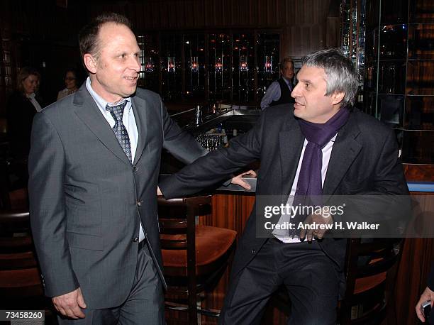 President of Picturehouse Bob Berney and producer Alain Goldman talk at a reception hosted by Picturehouse for "La Vie En Rose", the opening night...