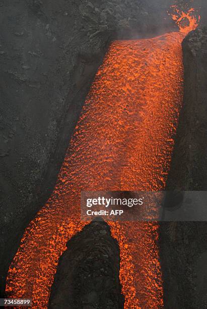 Aerial view from an Italian Protezione Civile helicopter shows the Stromboli volcano north of Sicily as it spews lava toward the sea, 01 March 2007,...