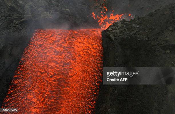 Aerial view from an Italian Protezione Civile helicopter shows the Stromboli volcano north of Sicily as it spews lava toward the sea, 01 March 2007,...