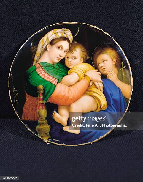 Copy of the 'Madonna della Sedia' by Raphael, showing the Madonna and Child watched over by John the Baptist. Artist dates: 1803