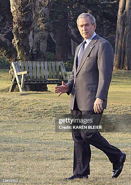 Washington, UNITED STATES: US President George W. Bush waves as he walks to Marine One as he departs the White House 01 March, 2007 in Washington,...